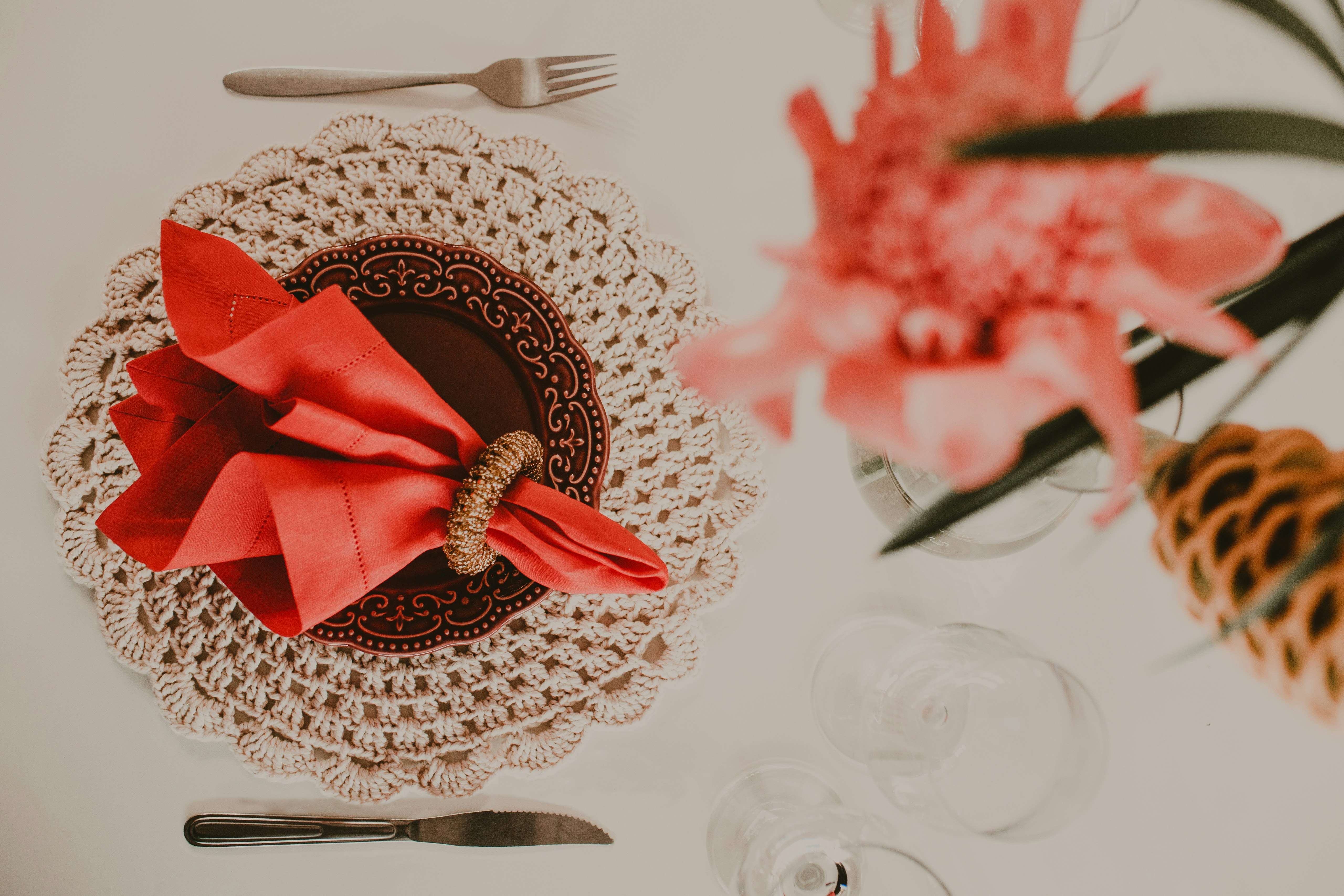 red and gold ribbon on white round table